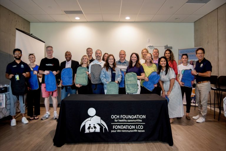 The OCH Foundation team was proud to be joined by community leaders and supporters (left to right) Former Mayor and current Board Member Jim Watson, City Councillors Rawlson King and Tim Tierney, Nick Ethier (OCH Foundation Vice Chair), Amber Tremblay-Chapman (Vice President, Accounting Manager – HEIN), Melissa Reeves (OCH Foundation Board Chair), Jennifer Stelzer (Director of Strategic Impact, Bryce Conrad (CEO of Hydro Ottawa), EnviroCentre), Jen Alvarenga (REMAX Good Sory), Elizabeth Benoit and Stéphane Giguère (CEO of Ottawa Community Housing) in support of Pack-a-Sack.