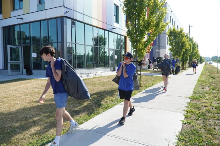 Volunteers from Youth In Policing Initiative (YIPI) provided the muscle we needed to transport over 2,000 backpacks directly to OCH communities.